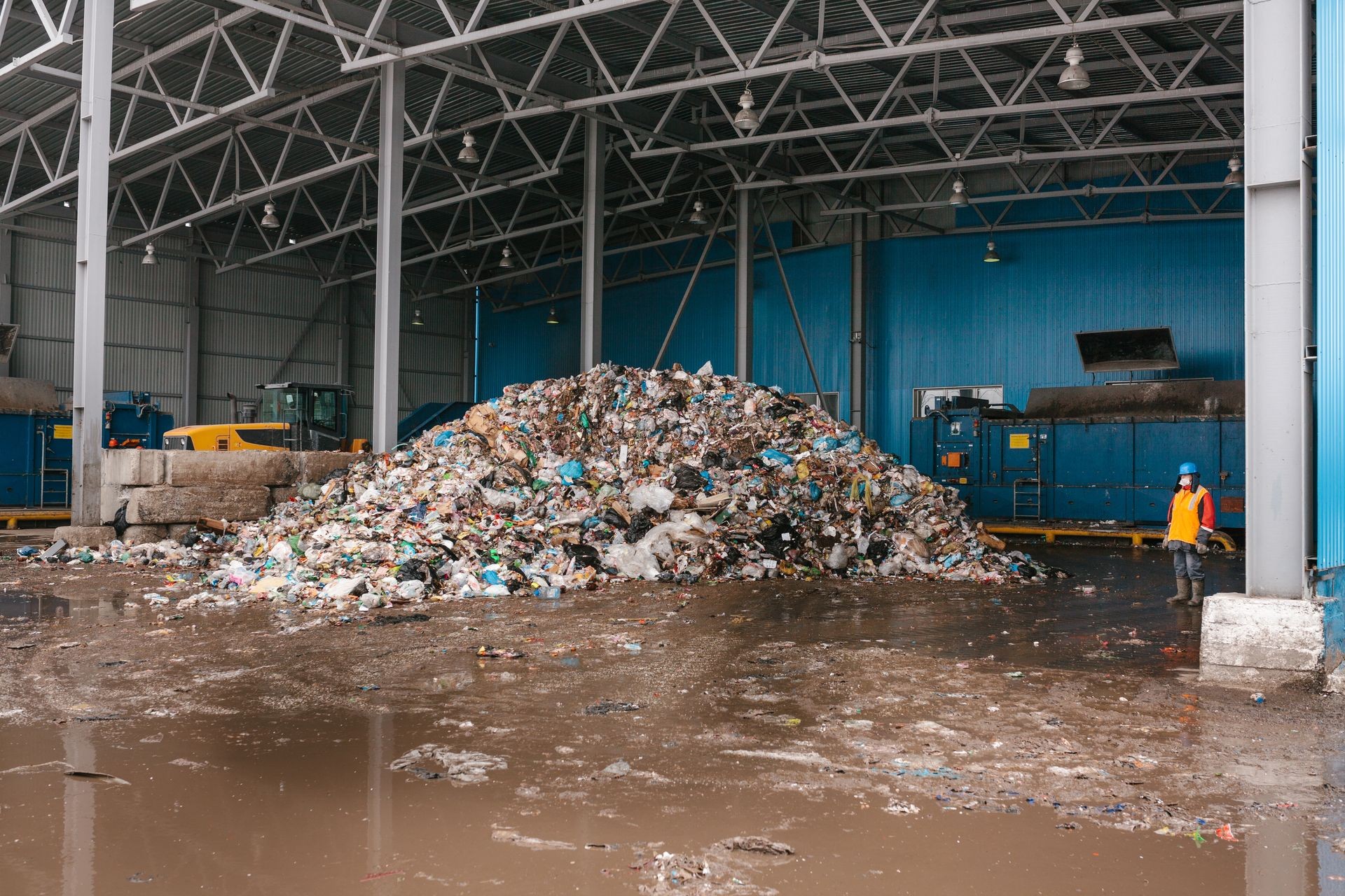 A pile of garbage in a waste storage area at a waste sorting plant. Technological process. Business for sorting and recycling.